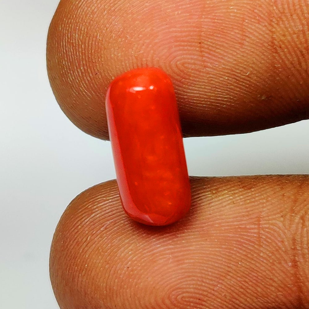 3.94 Ct Natural Orange Coral Capsule Cab: Weight - 3.94 Ct / Dimensions - 12.90 x 5.90 mm / Shape - Capsule Cab / Clarity - Translucent / Origin - Japan / Comments - None