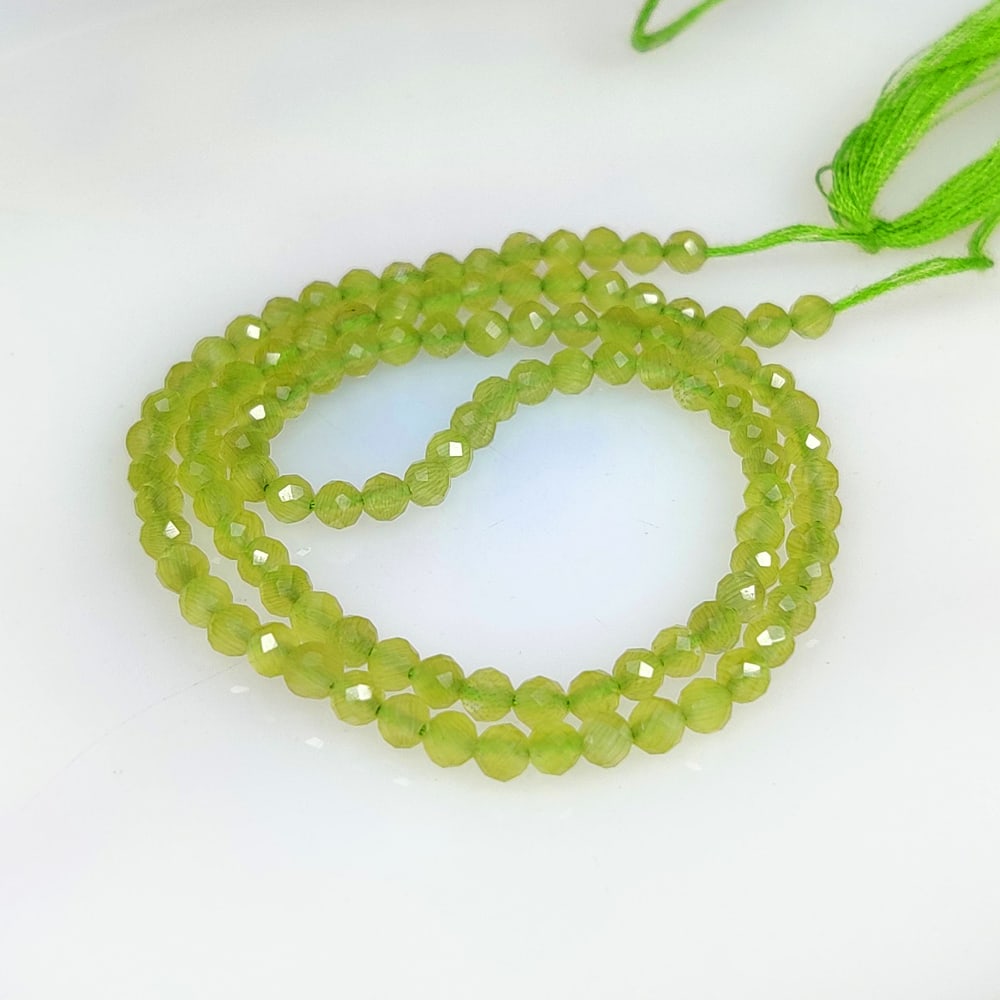 18.12 Ct Natural Green Peridot Round Drilled Beads: Weight - 18.12 Ct / Dimensions - 3.10 - 3.20 mm / 108 Pc's / Shape - Drilled Beads / Color - Green / Clarity - VVS / Origin - Pakistan / Treatment - None