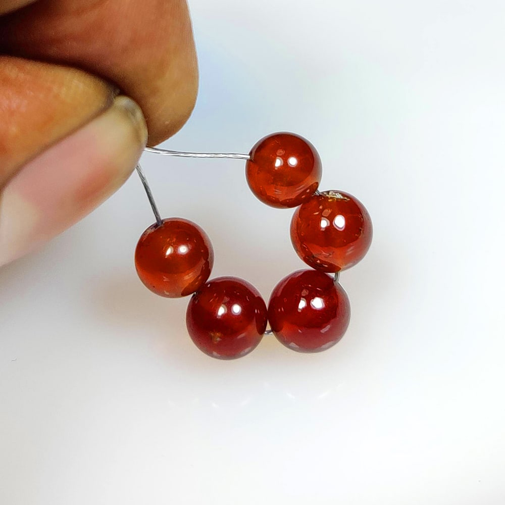 15.41 Ct Natural Hessonite Garnet Round Beads: Weight - 15.41 Ct / Dimensions - 6.60 - 7.10 mm / Shape - Round Beads / Clarity - Transparent / Origin - Nigeria / Treatment - None