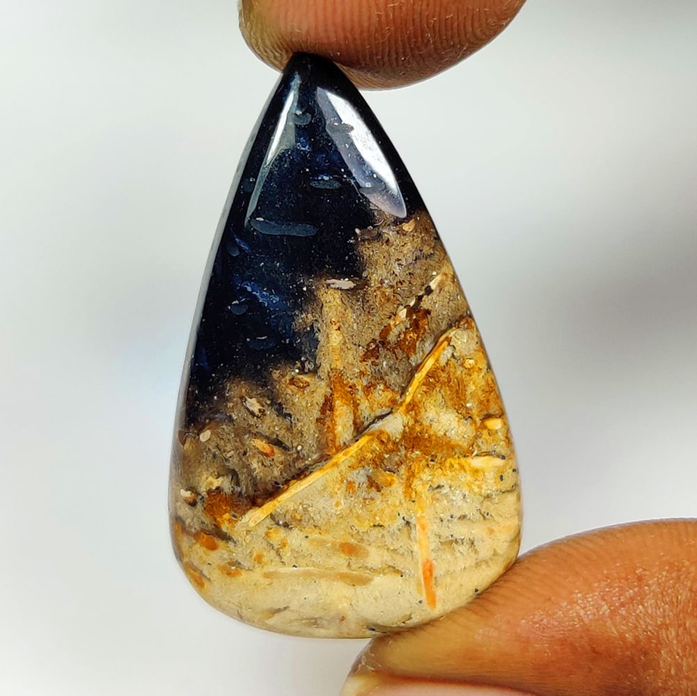 26.13 Ct Natural Black Palm Root Pear Cab (1 of 2)