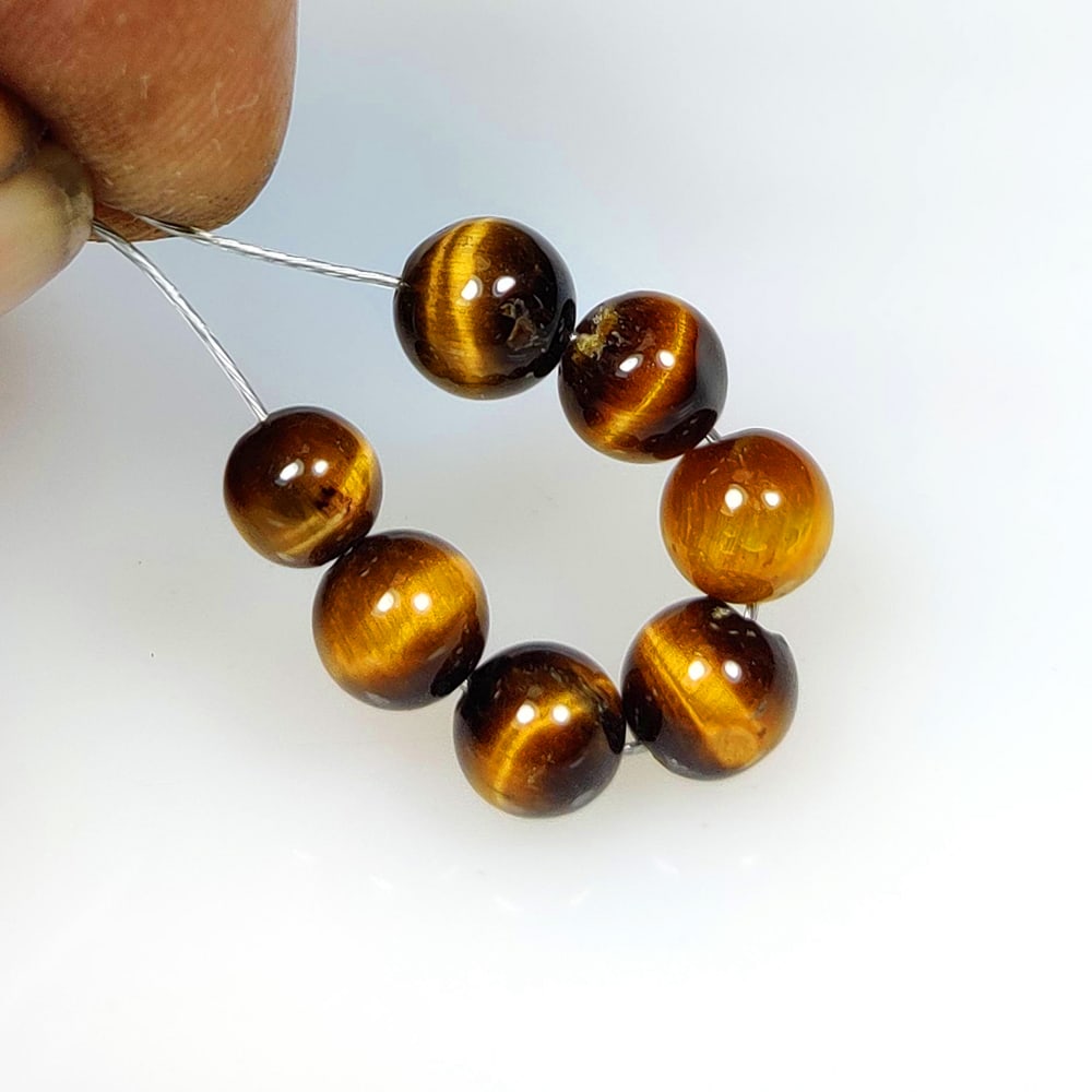 9.52 Ct Natural Tiger Eye Round Ball Beads: Weight - 9.52 Ct / Dimensions - 5.20 - 6.20 mm / 7 Pc's /Top Class Quality / Round Ball / Origin - Burmese / Comments - None