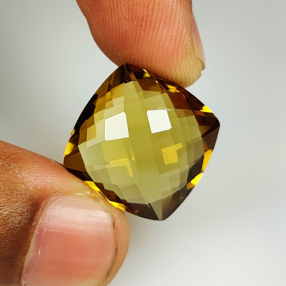 18.18 Ct Natural Honey Quartz Cushion Cut: Weight - 18.18 Ct / Dimensions - 17.90 x 17.80 x 8.90 mm / Shape - Cushion Cut / Color - Yellow / Clarity - VVS / Origin - Brazil / Treatment - Heated
