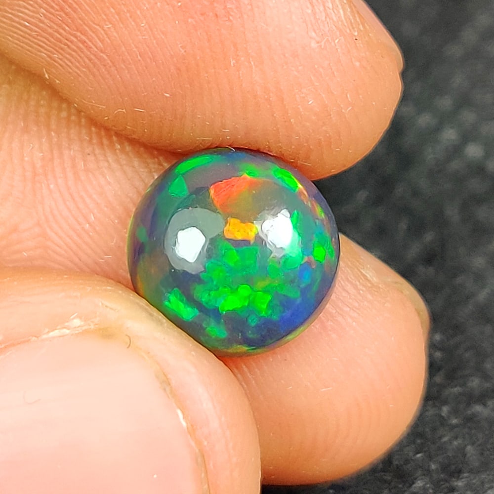 2.41 Ct Natural Black Flashing Fire Opal Round Cab (1 of 3)