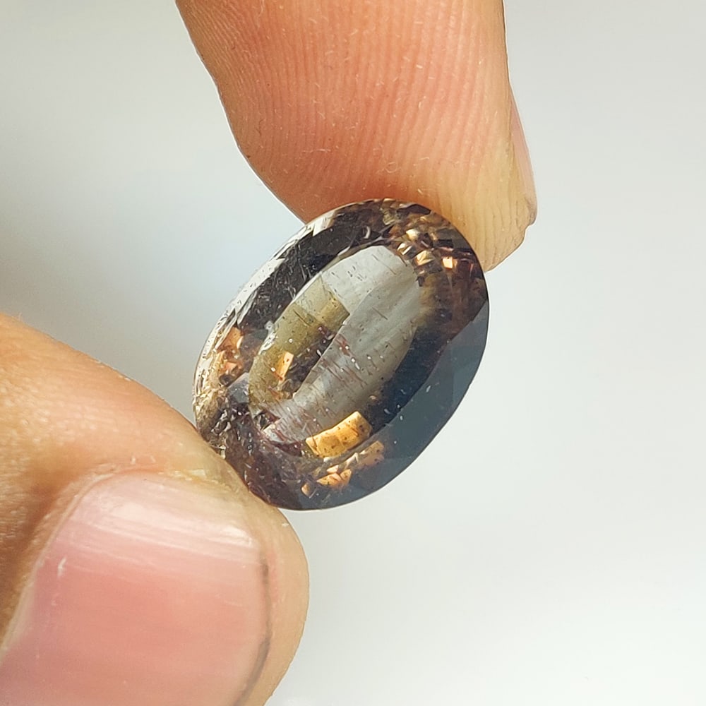 11.31 Ct Natural Rutile Smoky Quartz OVal Cut: Weight - 11.31 Ct / Dimensions - 16.00 x 11.40 x 9.70 mm / Shape & Cut - Oval Cut / Transparency - Transaprent / Origin - Norway / Comments - None