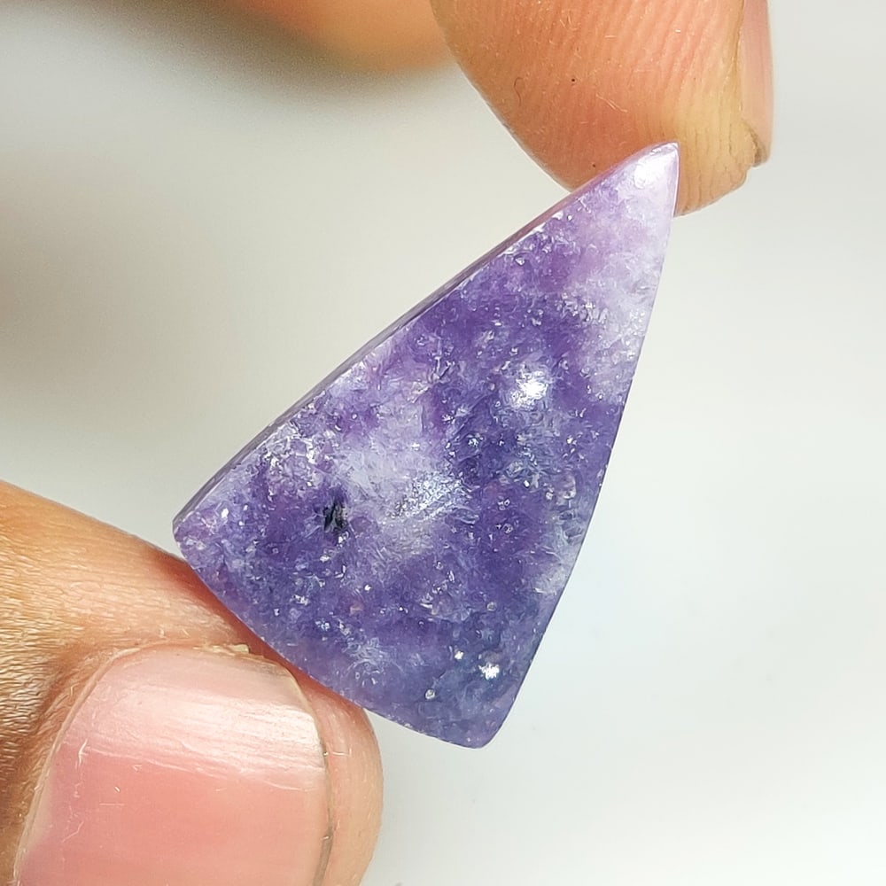 13.13 Ct Natural Purple Charoite Trillion Cab: Weight - 13.13 Ct / Dimensions - 25.10 x 15.40 x 4.50 mm / Shape - Trillion Cab / Color - Purple / Clarity - Opaque / Origin - Brazil / Treatment - None