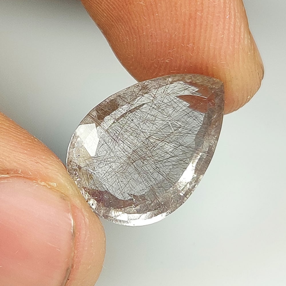 9.35 Ct Natural Rutile Quartz Pear Cut: Weight - 9.35 Ct / Dimensions - 18.30 x 12.80 x 7.00 mm / Shape & Cut - Pear Cut / Transparency - Transaprent / Origin - Norway / Comments - None