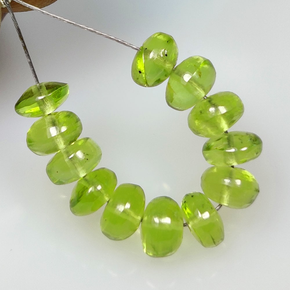 9.83 Ct Natural Green Peridot Round Beads: Weight - 9.83 Ct / Size - 5.20 - 5.40 mm / 12 Pc's / Shape - Round Beads / Color - Green / Clarity - VVS / Origin - Pakistan / Treatment - None