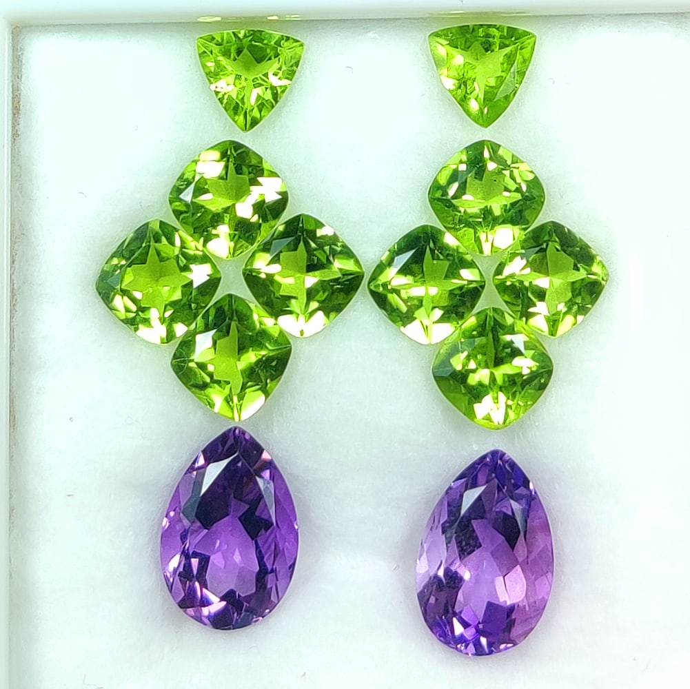 20.93 Ct Natural Amethyst & Peridot Mixed Cut Set: Weight - 20.93 Ct / Dimensions - 7.1x3.2 - 13.1x6.6 mm / 12 Pc's / Shape - MIxed Cut / Color - Purple & Green / Clarity - VVS / Origin - Pakistan / Treatment - None