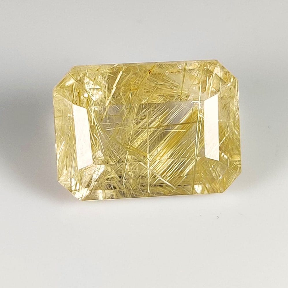 12.11 Ct Natural Golden Rutile Quartz Emerald Cut: Weight - 12.11 Ct / Dimensions - 16.00 x 11.80 x 8.80 mm / Shape & Cut - Emerald Cut / Transparency - Transaprent / Origin - Norway / Comments - None