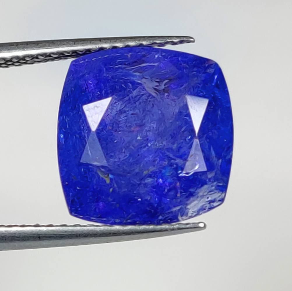 7.40 Ct Natural Tanzanite Cushion Cut: Weight : 7.40 Ct / Dimensions : 11.70 x 11.30 x 7.60 mm / Shape : Cushion Cut / Color : Purplish Blue / Clarity : Transparent / Treatment : Heated