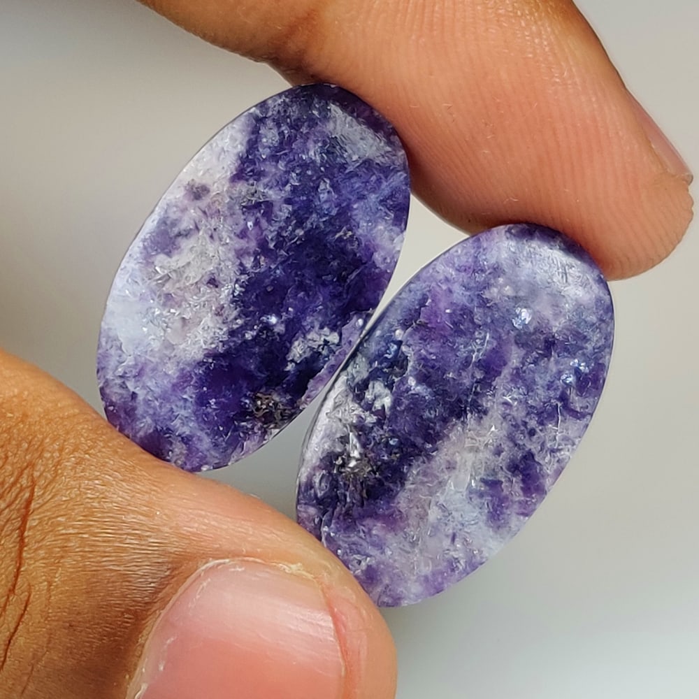 29.17 Ct Natural Purple Charoite Oval Cab Pair: Weight - 29.17 Ct / Dimensions - 24.20 x 13.80 x 4.20 mm / 2 PC's / Shape - OVal Cab / Color - Purple / Clarity - Transparent / Origin - Brazil / Treatment - None