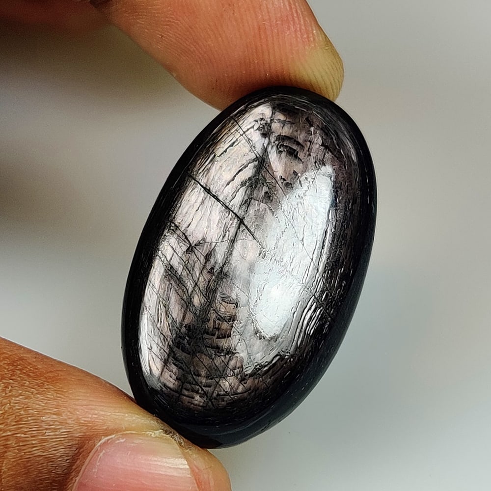 47.25 Ct Natural Black Hypersthene Oval Cab (1 of 2)