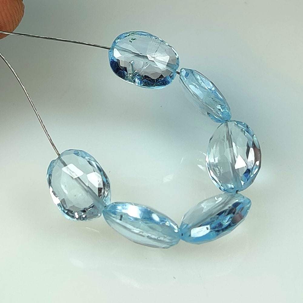 17.00 Ct Natural Blue Topaz Drilled Oval Beads: Weight - 17.00 Ct / Dimensions - 9.5x7.3 - 10.0x7.5 mm / 6 PC's / Shape & Cut - Drilled Oval Beads / Color - Blue / Transparency - VVS / Origin - Brazil / Comments - Irradiated