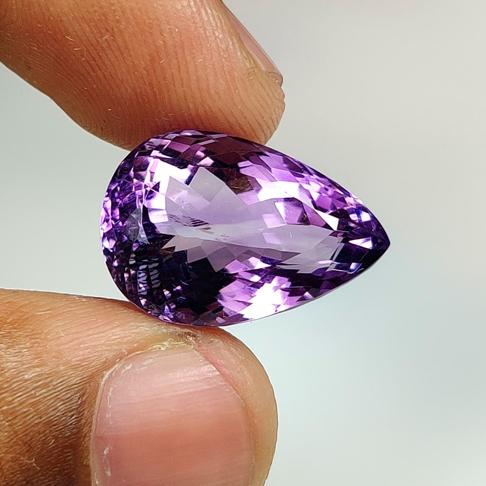 17.37 Ct Natural Purple Amethyst Pear Cut: Weight - 17.37 Ct / Dimensions - 19.90 x 13.70 x 11.10 mm / Shape - Pear Cut / Color - Purple / Clarity - VVS / Origin -Brazil / Treatment - Heated