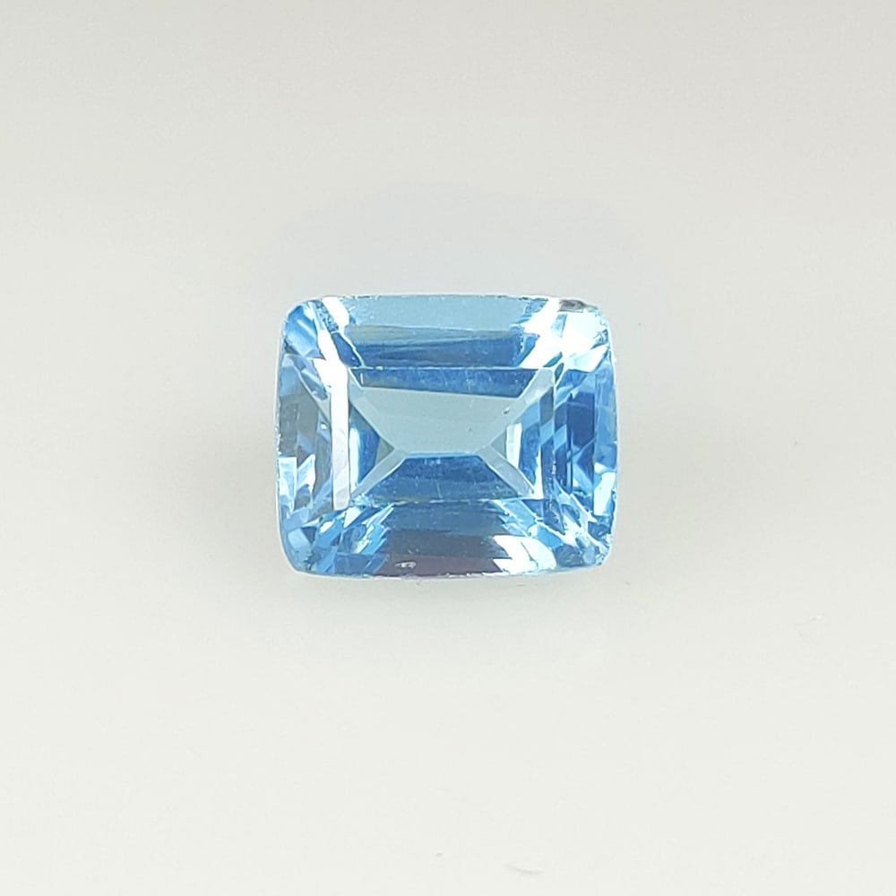 6.30 Ct Natural Blue Topaz Cushion Cut: Weight - 6.30 Ct / Dimensions - 10.50 x 8.80 x 7.00 mm / Shape - Cushion Cut / Color - Blue / Clarity - VVS / Origin - Brazil / Treatment - Irradiated