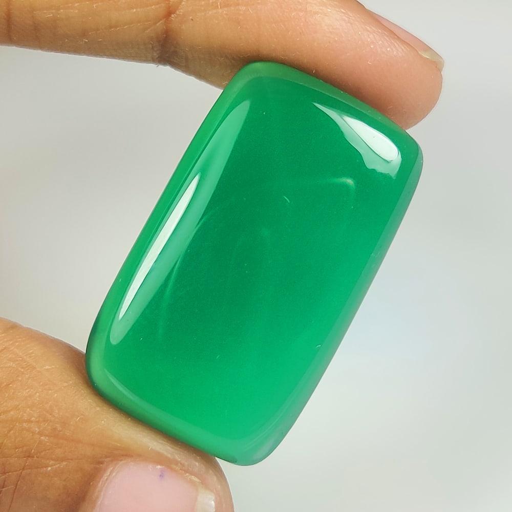 28.27 Ct Natural Green Onyx Cushion Cab: Weight - 28.27 Ct / Size - 29.00 x 16.70 x 5.90 mm / Shape - Cushion Cab / Color - Green / Clarity - OPaque / Origin - Brazil / Treatment - None