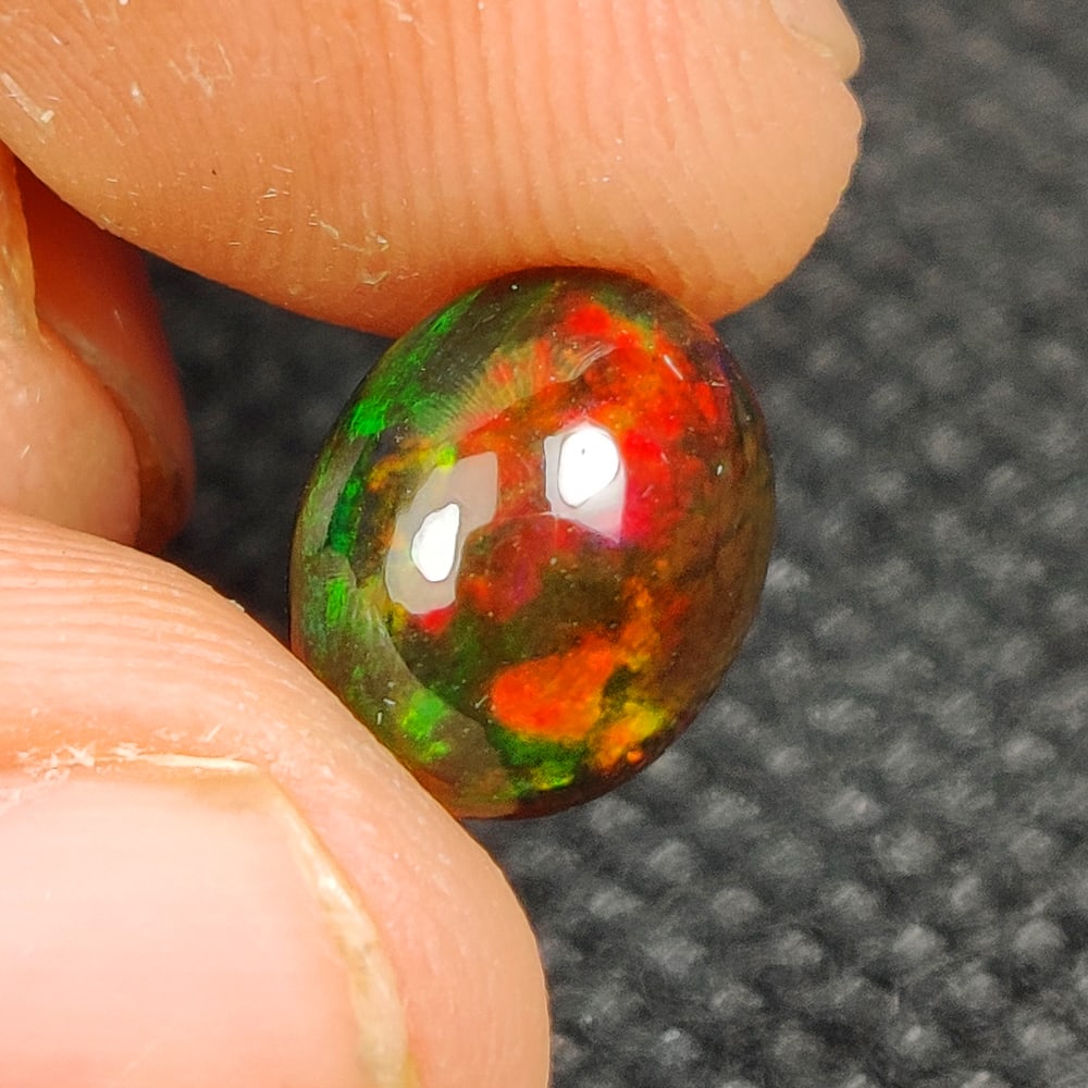1.95 Ct Natural Black Flashing Fire Opal Oval Cab (1 of 3)