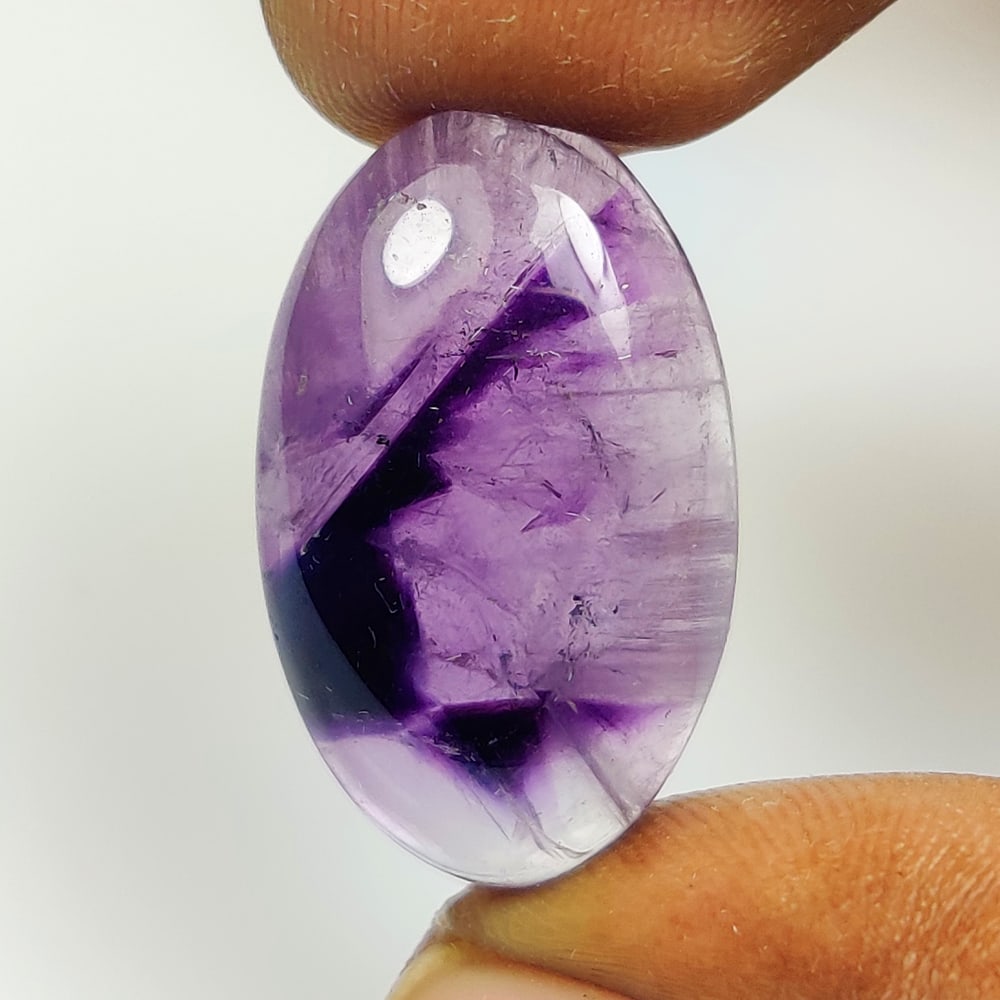 18.90 Ct Natural Star Purple Amethyst Oval Cab: Weight - 18.90 Ct / Dimensions - 24.70 x 14.90 x 6.30 mm / Shape - Oval Cab / Color - Purple / Clarity - VVS / Origin -Brazil / Treatment - Heated