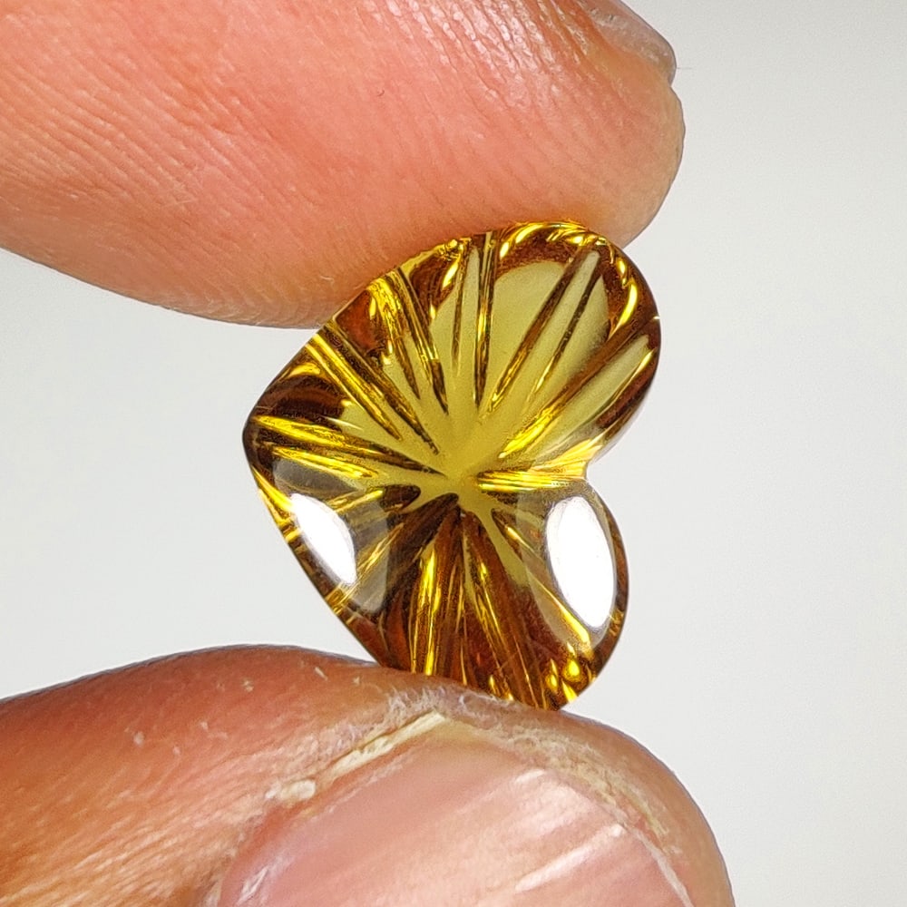 3.34 Ct Natural Yellow Citrine HearT Carving: Weight - 3.34 Ct / Dimensions - 11.90 x 9.50 x 5.90 mm / Shape & Cut - Heart Carving / Color - Yellow / Clarity - VVS / Origin - Brazil / Comments - Heated