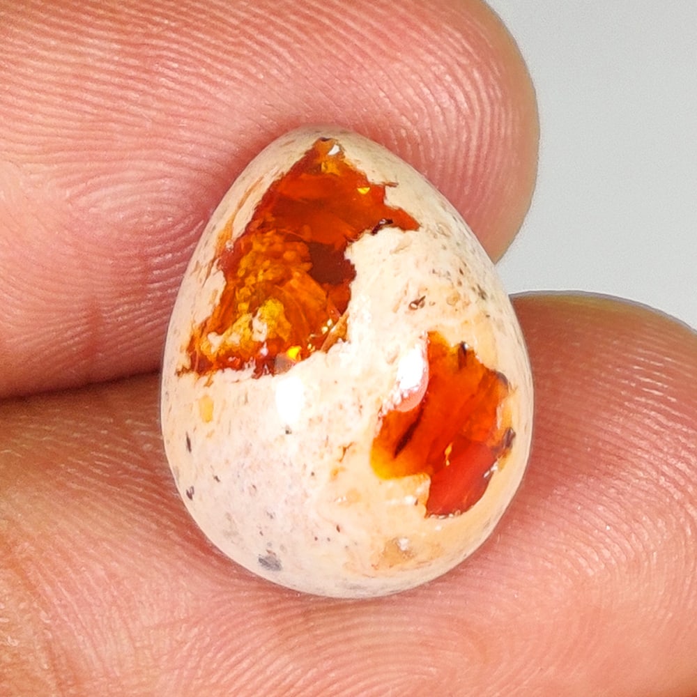 8.00 Ct Natural Fire Opal Pear Cab: weight - 8.00 Ct / Dimensions - 16.00 x 12.00 x 7.50 mm / Shape - Excellent Pear Cab / Origin - Brazil / Treatment - None
