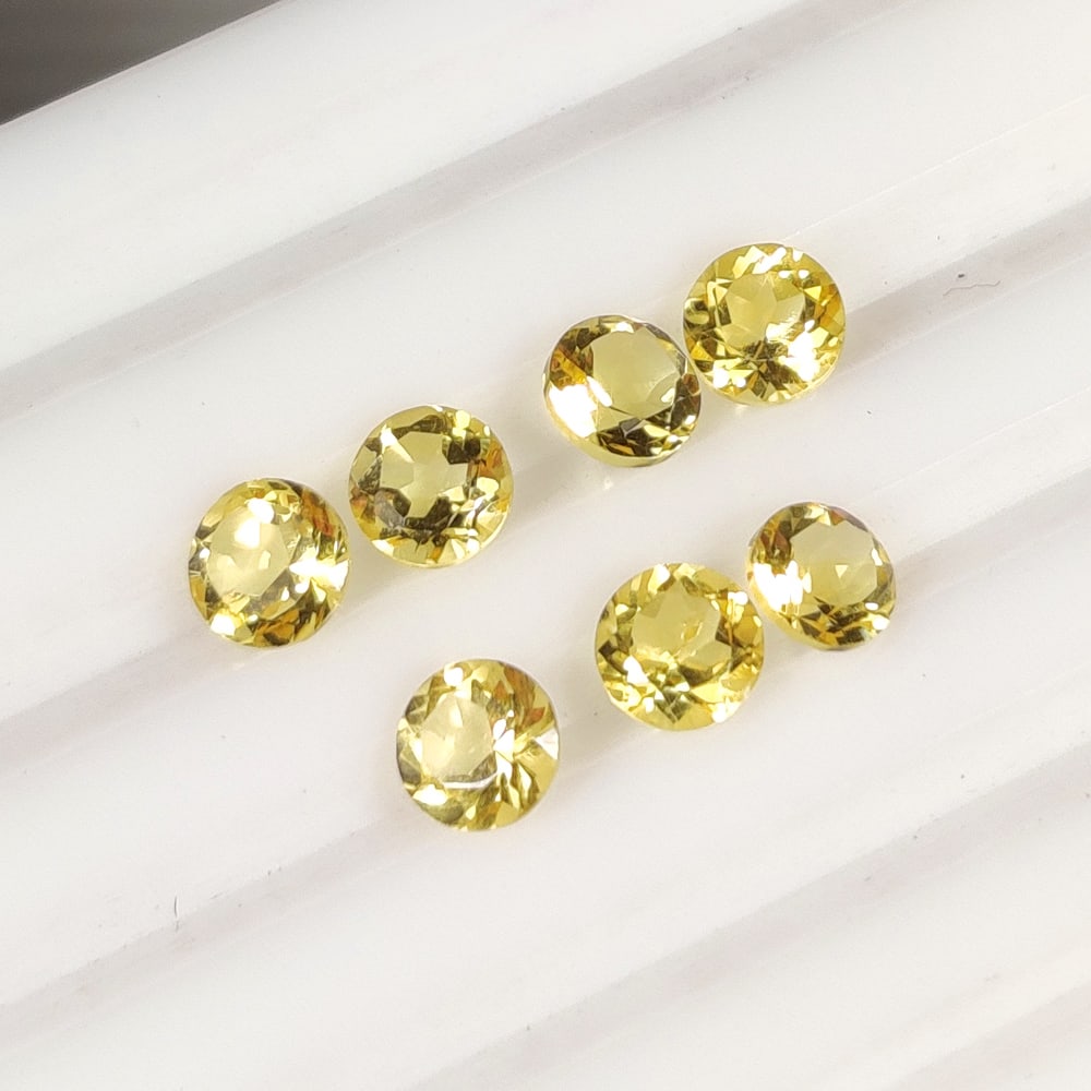 3.58 Ct Natural Yellow Citrine Round Cut Set: Weight - 3.58 Ct / Size - 5.20 - 5.30 mm / 7 Pc's / Shape - Round Cut / Color - Yellow / Clarity - VVS / Origin - Brazil / Treatment - Heated