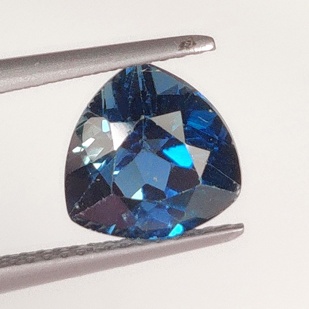 3.06 Ct Natural London Blue Topaz Trillion Cut: Weight - 3.06 Ct / Size - 9.00 x 9.00 x 5.70 mm / Shape - Trillion Cut / Color - Blue / Clarity - VVS / Origin - Brazil / Treatment - Irradiated