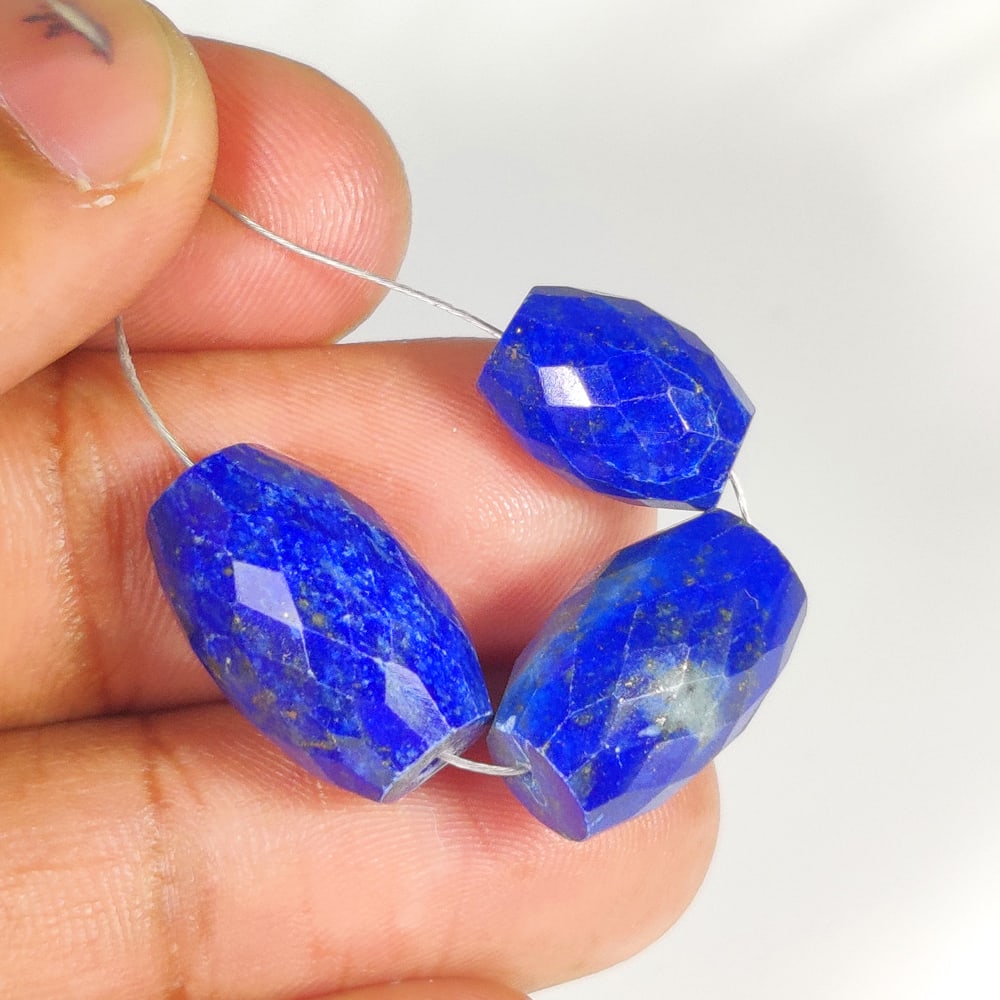 33.64 Ct Natural Blue Lapis Lazuli Dumbbell Cut Beads: Weight - 33.64 Ct / Dimensions - 12.1x8.6 - 16.1x10.4 mm / 3 Pc's/ Shape - Dumbbell Cut Beads / Clarity - Opaque / Origin - Afghanisthan / Treatment - None