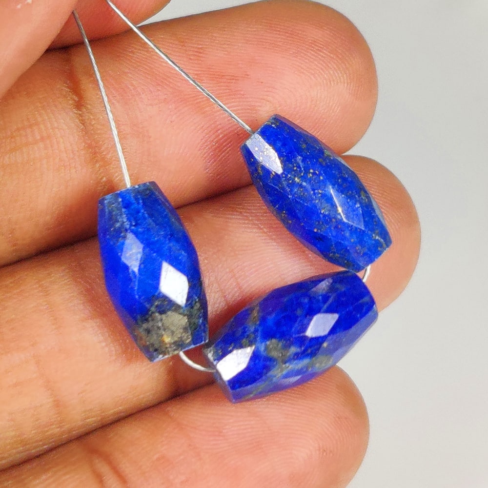 22.57 Ct Natural Blue Lapis Lazuli Dumbbell Cut Beads: Weight - 22.57 Ct / Dimensions - 14.2x7.7 - 14.8x7.8 mm / 3 PC's / Shape - Dumbbell Cut Beads / Clarity - Obaque / Origin - Afghanisthan / Treatment - None