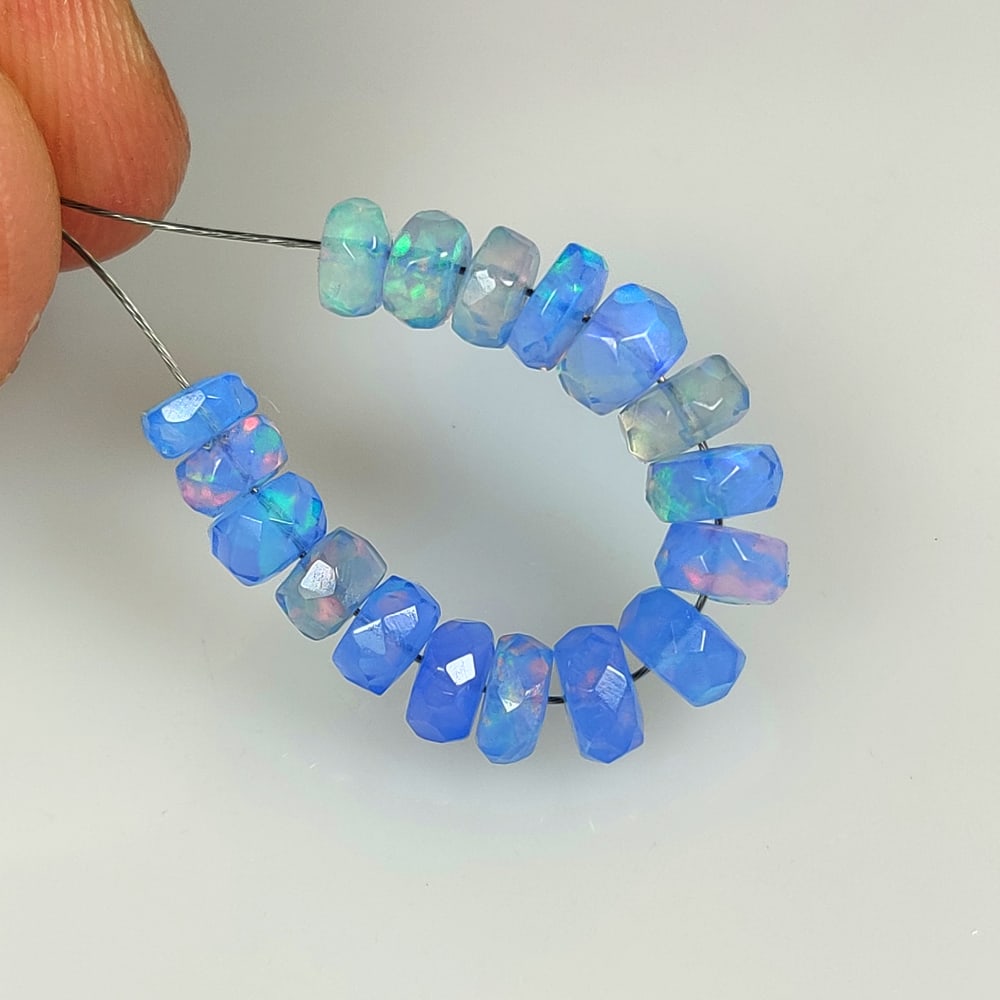 6.00 Ct Natural Blue Fire Opal Round Beads: Weight - 6.00 Ct / Size - 4.50 - 5.20 mm / 17 Pc's / Shape - Round Beads / Color - Blue / Clarity - Translucent / Origin - Ethiopia / Treatment - Color Heated