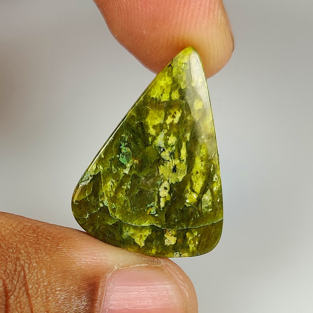 14.00 Ct Natural Green Opal Trillion Cab: weight - 14.00 Ct / Dimensions - 24.40 x 18.10 x 4.50 mm / Shape & Cut - Excellent Trillion Cab / Origin - Brazil / Comments - None
