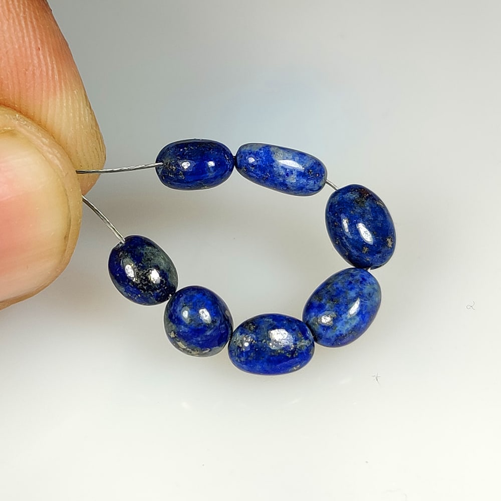 8.95 Ct Natural Blue Lapis Lazuli Dumbbell Beads: Weight - 8.95 Ct / Dimensions - 6.3x4.7 - 7.0x5.2 mm / 7 PC's / Shape - Dumbbell Beads / Clarity - Obaque / Origin - Afghanisthan / Treatment - None