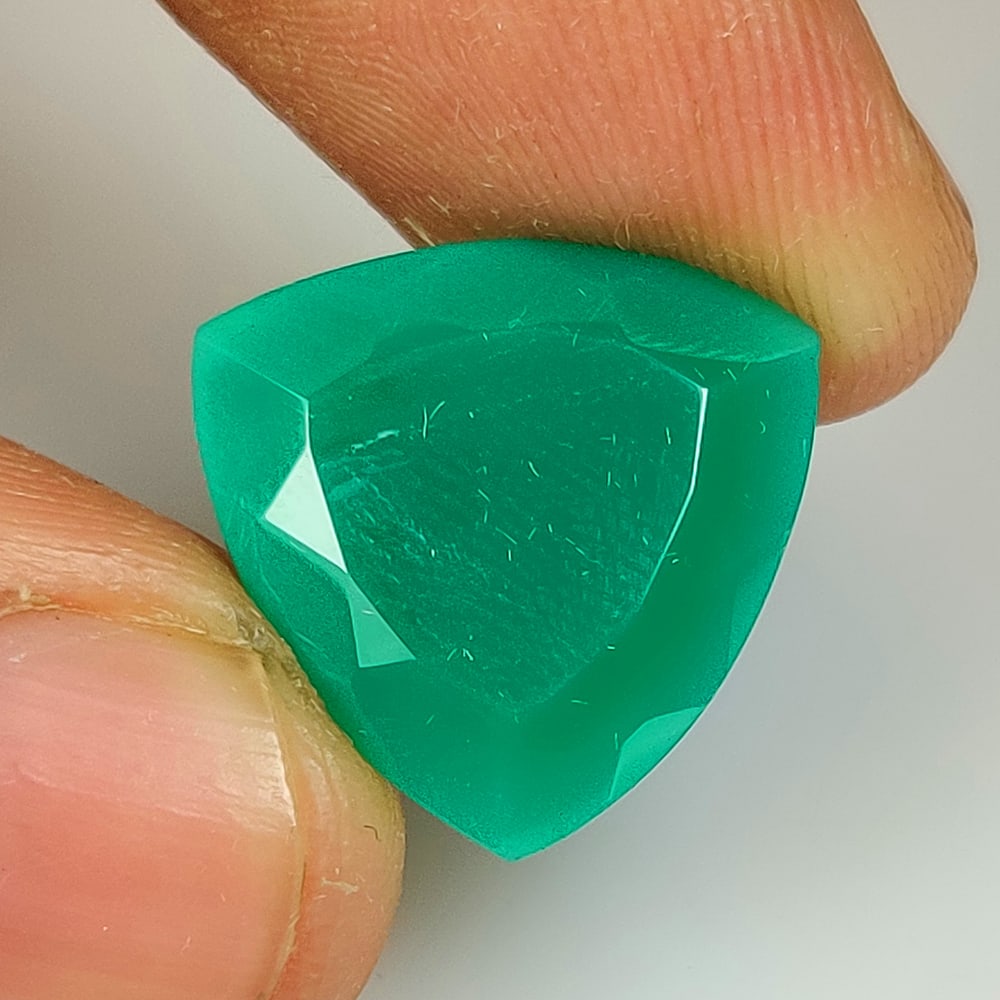 11.67 Ct Natural Green Chrysoprase Trillion Cut: Weight - 11.67 Ct / Size - 17.40 x 17.20 x 7.60 mm / Shape - Trillion Cut / Clarity - Opaque / Origin - Brazil / Treatment - None