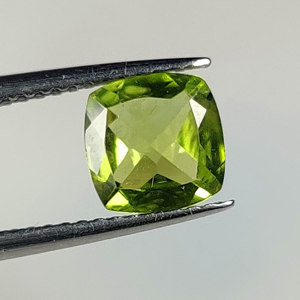 1.32 Ct Natural Green Peridot Cushion Cut: Weight - 1.32 Ct / Dimensions - 7.00 x 7.00 x 3.40 / Shape - Cushion Cut / Color - Green / Clarity - VVS / Origin - Pakistan / Treatment - None