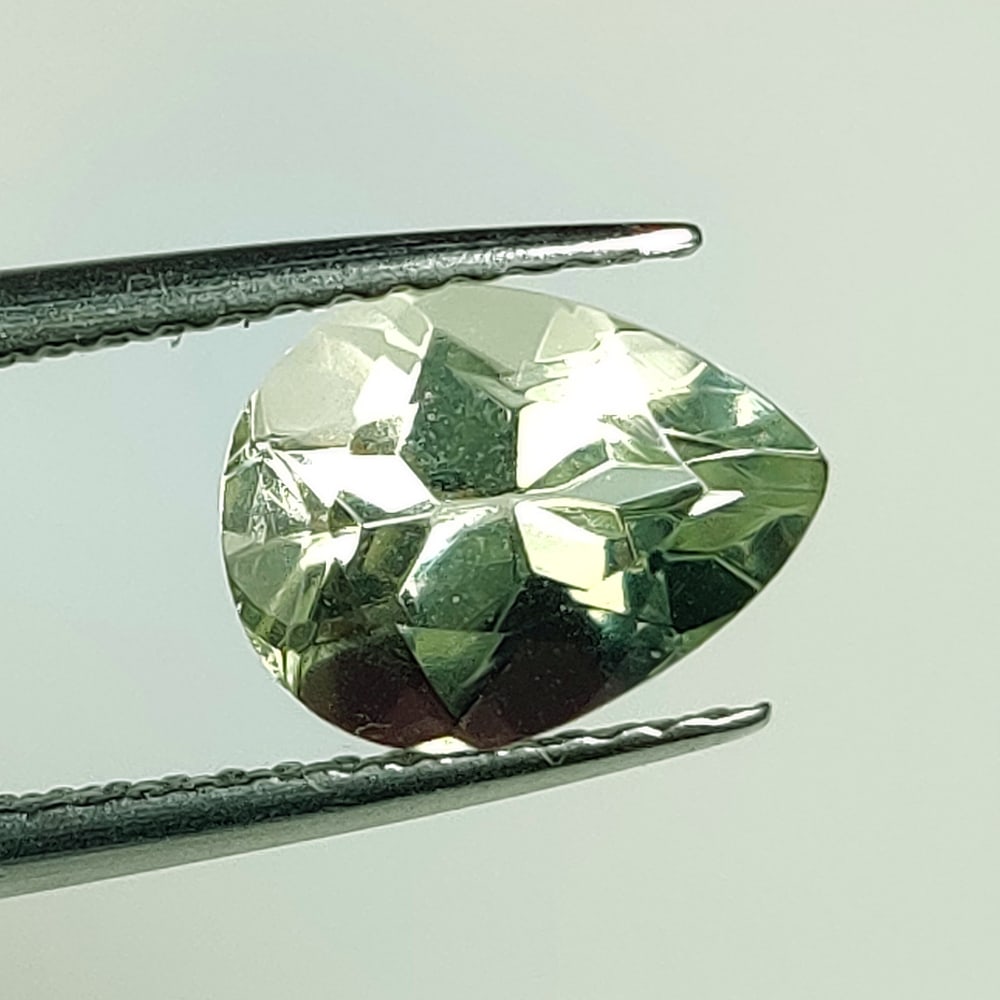 1.73 Ct Natural Green Amethyst Pear Cut: Weight - 1.73 Ct / Size - 9.00 x 6.90 x 5.30 mm / Shape - Pear Cut / Color - Green / Clarity - VVS / Origin - Brazil / Treatment - Heated