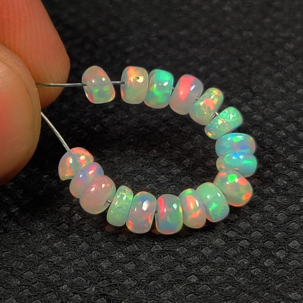 3.72 Ct Natural Multicolor Welo Opal Flash Fire Round Beads: Weight - 3.72 Ct / Dimensions - 4.10 - 4.20 mm / 17 Pc's / Shape & Cut - Drilled Round Beads / Color - Multicolor / Transparency - Translucent / Origin - Ethiopia / Comments - None