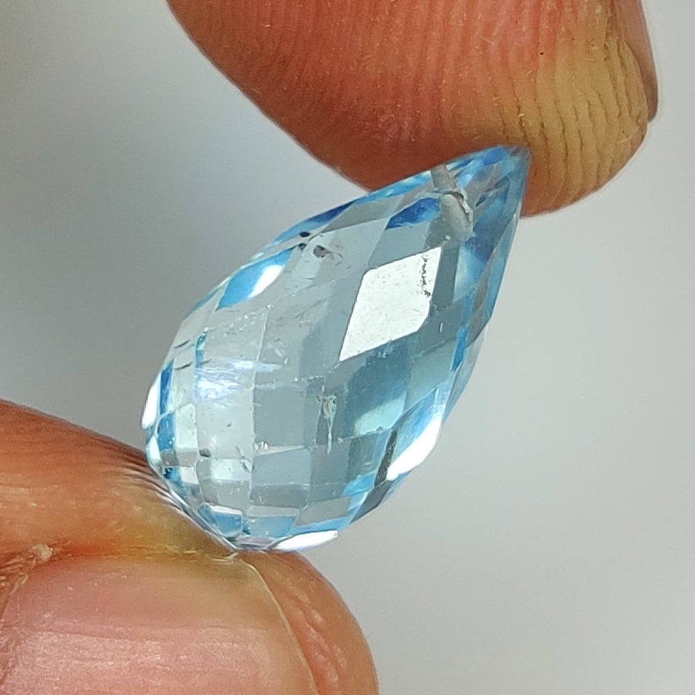 6.58 Ct Natural Blue Topaz Pear Drop: Weight - 6.58 Ct / Dimensions - 14.70 x 7.60 x 7.60 mm / Shape & Cut - Pear Drop / Color - Blue / Transparency - VVS / Origin - Brazil / Comments - Irradiated