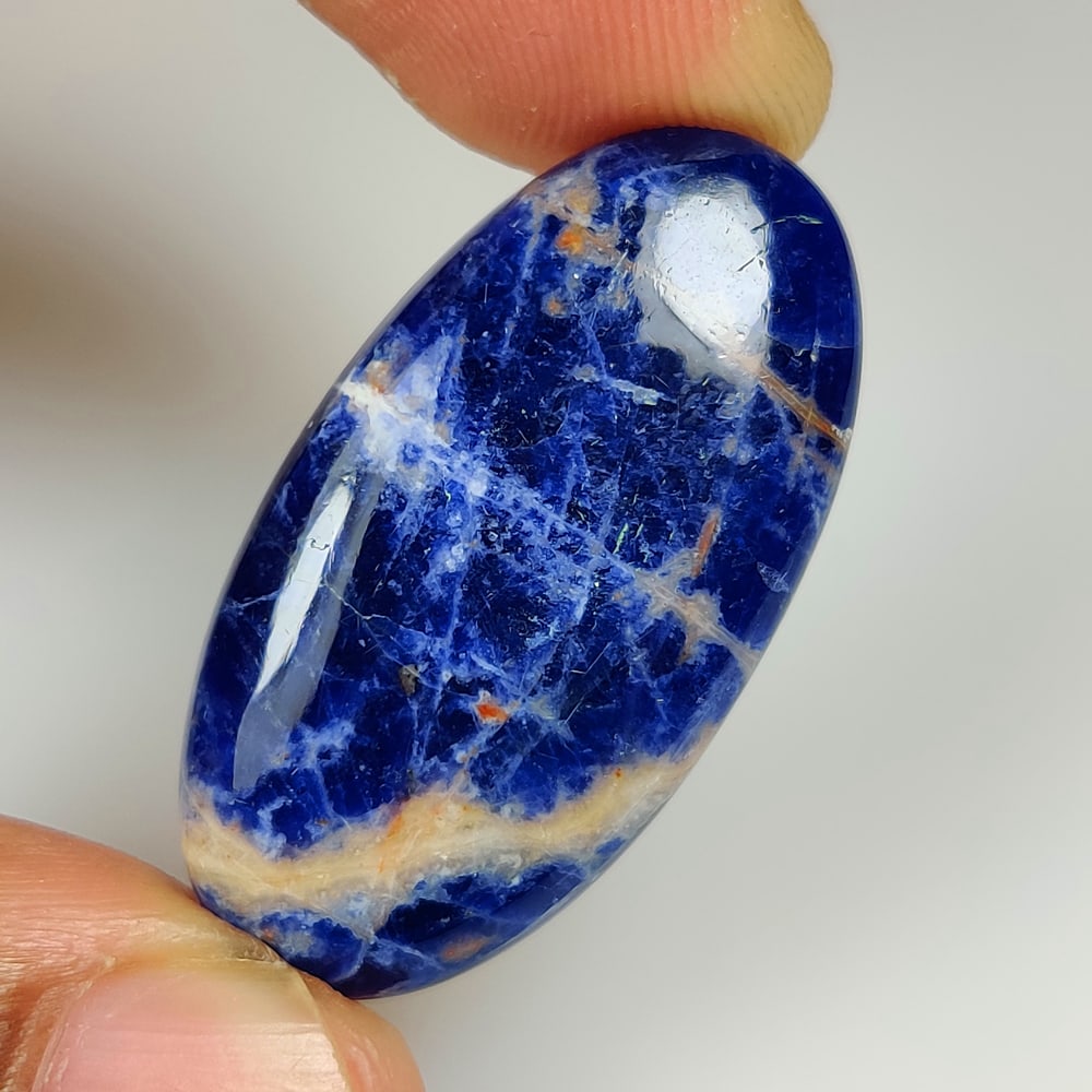 23.77 Ct Natural Blue Sodalite Oval Cab: Weight - 23.77 Ct / Size - 35.00 x 18.20 x 5.10 mm / Shape - Oval Cab / Clarity - Opaque / Origin - Russia / Treatment - None