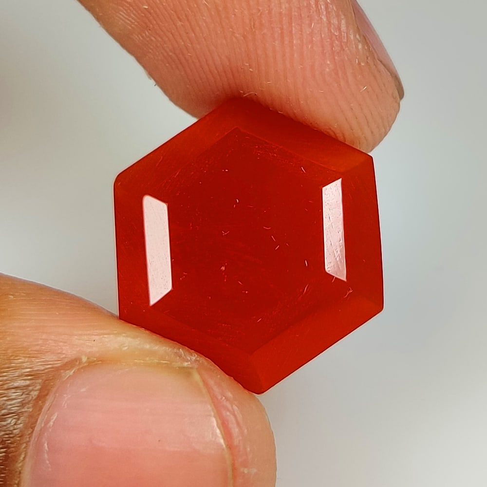 12.64 Ct Natural Orange Onyx Hexagon Cut: Weight - 12.64 Ct / Size - 18.20 x 16.20 x 7.80 mm / Shape - Hexagon Cut / Clarity - Opaque / Origin - Brazil / Treatment - None