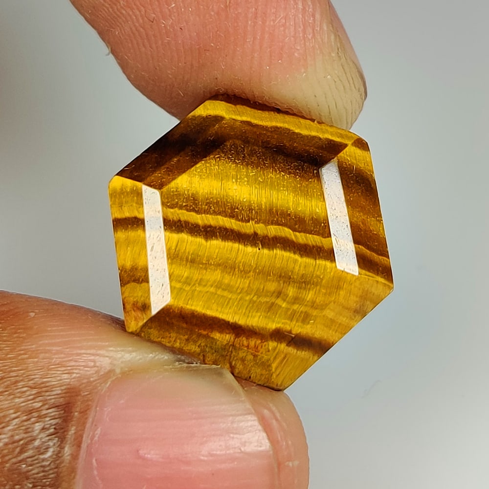 12.77 Ct Natural Tiger Eye Hexagon Cut: Weight - 12.77 Ct / Dimensions - 18.30 x 16.30 x 7.60 mm / Top Class Quality / Hexagon Cut / Origin - Burmese / Comments - None