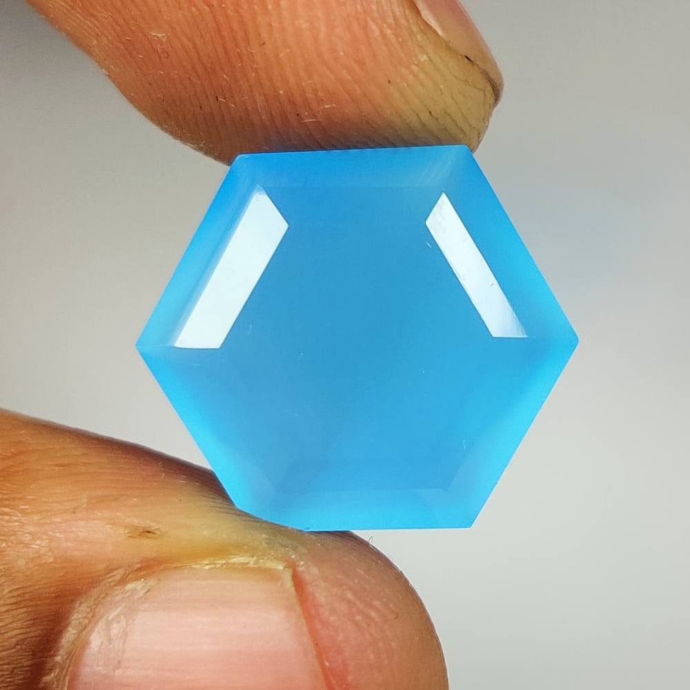 11.96 Ct Natural Blue Onyx Hexagon Cut: Weight - 11.96 Ct / Dimensions - 17.70 x 15.60 x 7.60 mm / Shape - Hexagon Cut / Clarity - Opaque / Origin - Brazil / Comments - None