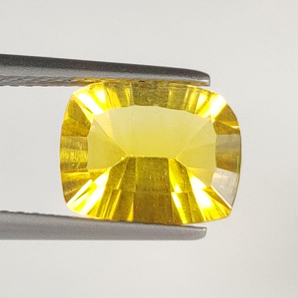 2.94 Ct Natural Yellow Flourite Cushion Cut: Weight - 2.94 Ct / Dimensions - 10.20 x 8.10 x 4.90 mm / Shape & Cut - Cushion Cut / Transparency - VVS / Origin - Brazil / Comments - None