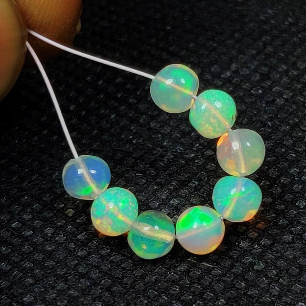 2.91 Ct Natural Multicolor Welo Opal Flash Fire Round Ball Beads: Weight - 2.91 Ct / Dimensions - 4.00 - 4.40 mm / 8 Pc's / Shape & Cut - Round Ball Beads / Color - Multicolor / Transparency - Translucent / Origin - Ethiopia / Comments - None