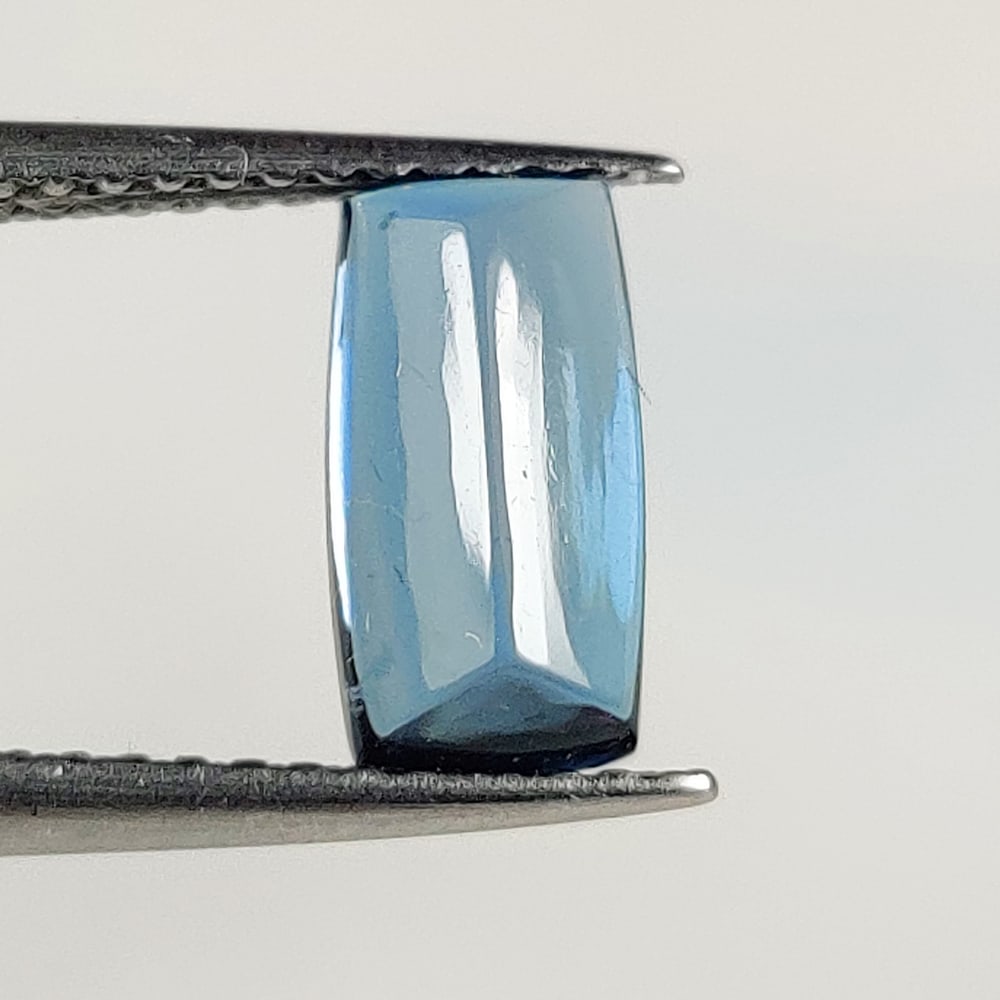 1.53 Ct Natural London Blue Topaz Cushion Cab: Weight - 1.53 Ct / Size - 9.40 x 4.90 x 3.00 mm / Shape - Cushion Cab / Color - Blue / Clarity - VVS / Origin - Brazil / Treatment - Irradiated