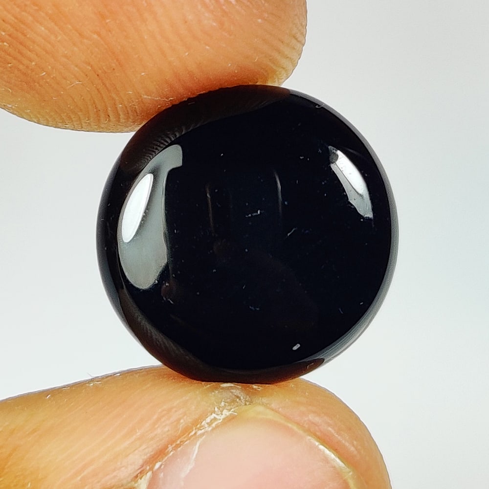 7.64 Ct Natural Black Onyx Round Cab: Weight - 7.64 Ct / Dimensions - 14.40 x 14.40 x 4.70 mm / Shape - Round Cab / Color - Black / Clarity - OPaque / Origin - Brazil / Treatment - None