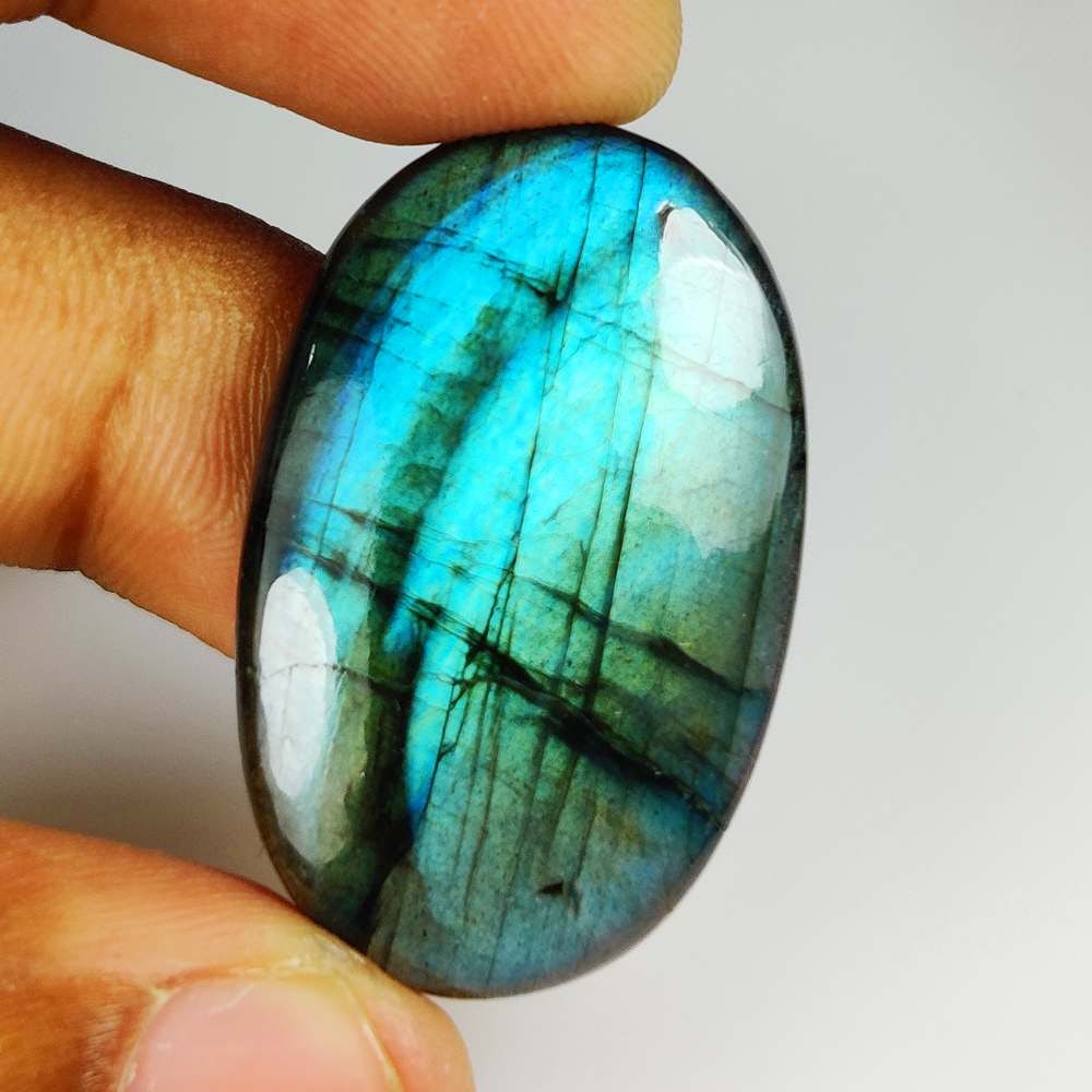 54.50 Ct Natural Blue Shaded Labradorite Oval Cab: Weight - 54.50 Ct / Size - 36.00 x 23.00 x 7.50 mm / Shape - Excellent Oval cab / Clarity - Opaque / Origin - Africa / Treatment - None