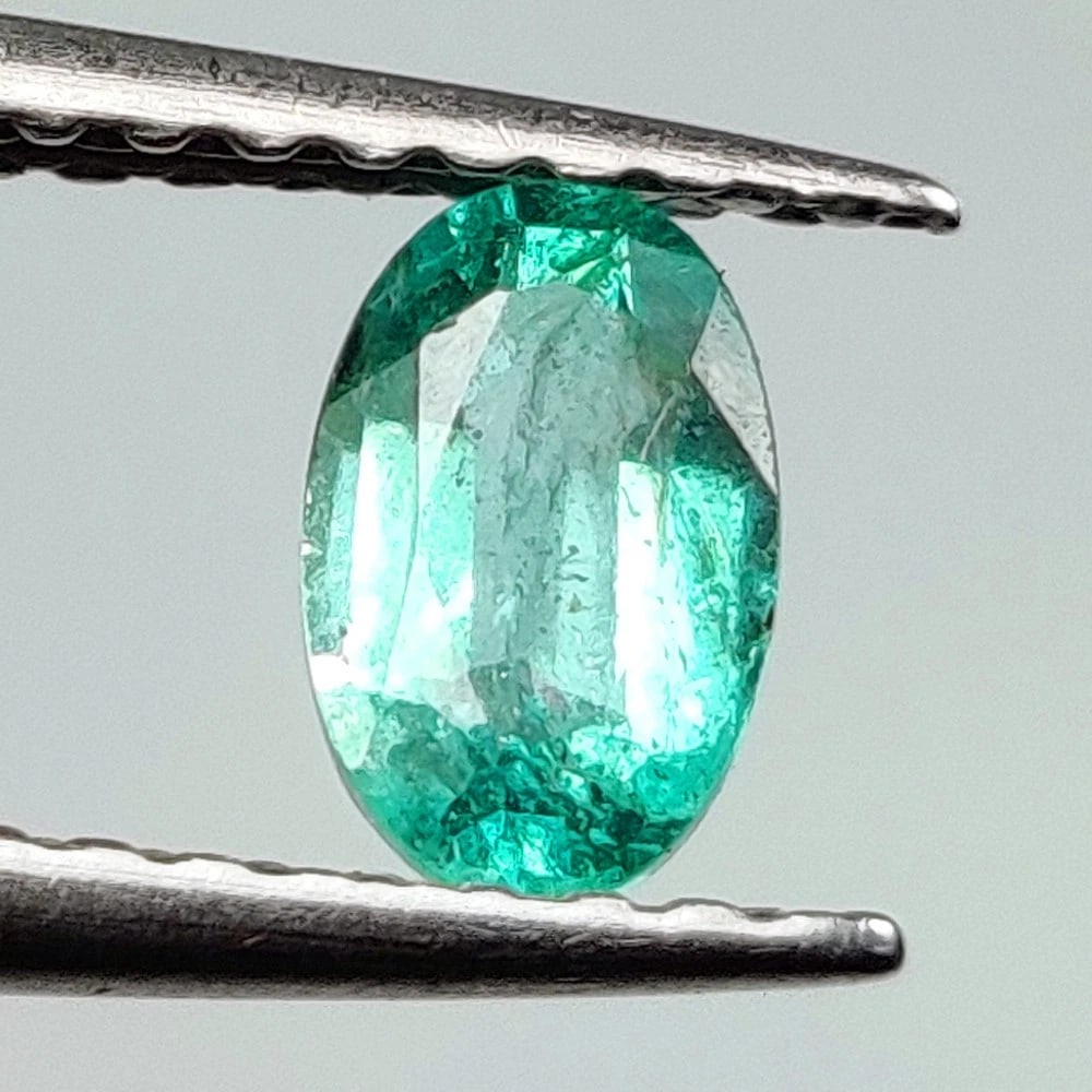 0.36 Ct Natural Zambian Green Emerald Oval Cut: Weight - 0.36 Ct / Dimensions - 5.90 x 3.80 x 2.60 mm / Shape - Oval Cut / Color - Green / Clarity - SI / Origin - Zambia / Treatment - Natural Emeralds are commonly enhanced by oil
