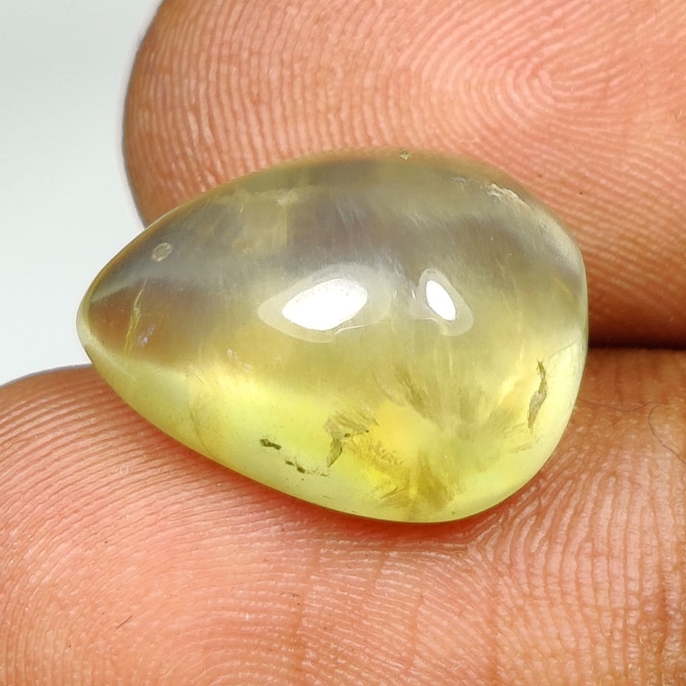 11.67 Ct Natural Prehnite Pear Cab: Weight - 11.67 Ct / Dimensions - 16.10 x 12.20 x 8.20 mm / Shape - Pear Cab / Clarity - Semi Transaprent / Origin - India / Comments - None