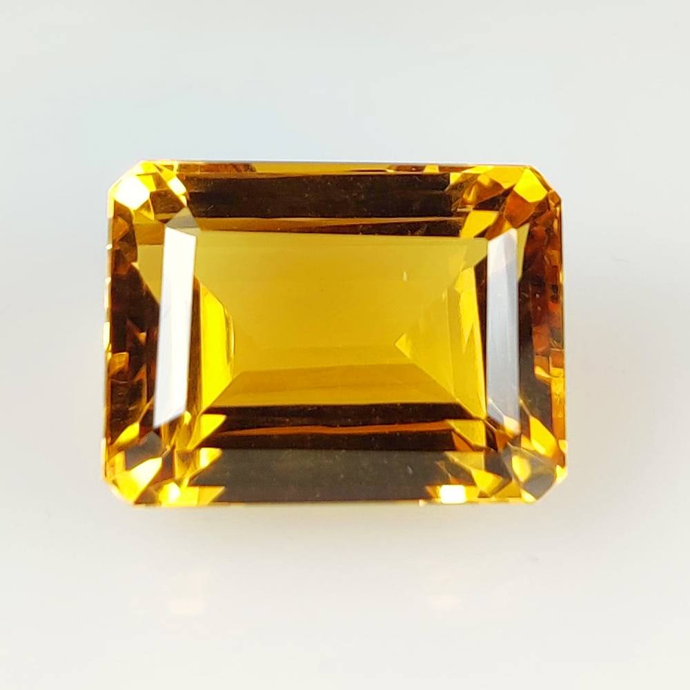 23.87 Ct Natural Yellow Citrine Octagon Cut: Weight - 23.87 Ct / Size - 18.40 x 13.60 x 11.60 mm / Shape - Octagon Cut / Color - Yellow / Clarity - VVS / Origin - Brazil / Treatment - Heated