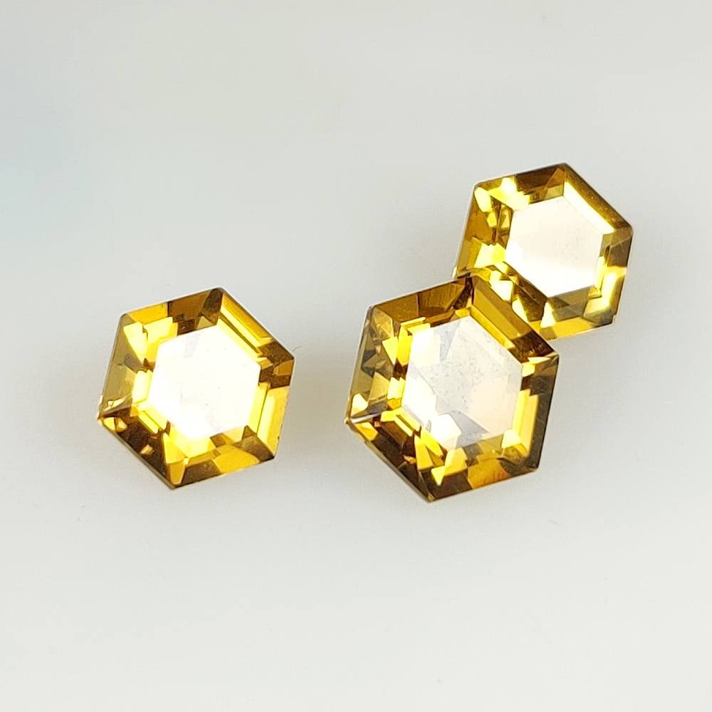 6.67 Ct Natural Yellow Citrine Hexagon Cut Set: Weight - 6.67 Ct / Dimensions - 8.0x5.2 - 10.2x6.2 mm / 3 Pc's / Shape - Hexagon cut / Color - Yellow / Clarity - VVS / Origin - Brazil / Treatment - Heated