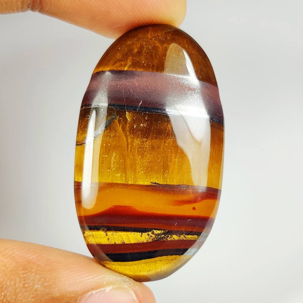 60.21 Ct Natural Tiger eye Oval Cab (1 of 2)